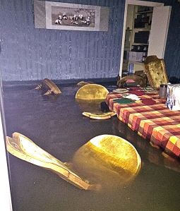 Flood waters inside the home of Xiaodi Lin and Robert Raphael. (Photo Credit: Robert Raphael)