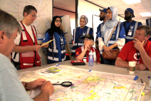 Derrick Lea, director of the U.S. program for Islamic Relief USA, and Abdullah Shawky of Dallas, check over a map before heading out with Red Cross damage assessment teams to help with determining the extent of damage to flooded  areas of Houston, Texas. (Photo by Carl Manning/American Red Cross)